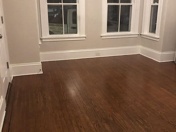 Living room with ceiling fan and built ins