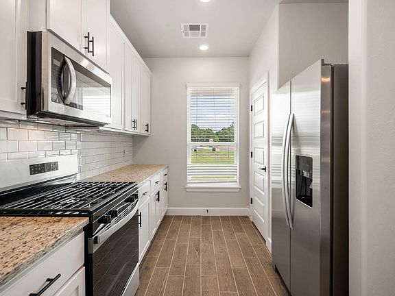 The kitchen has energy-efficient appliances.