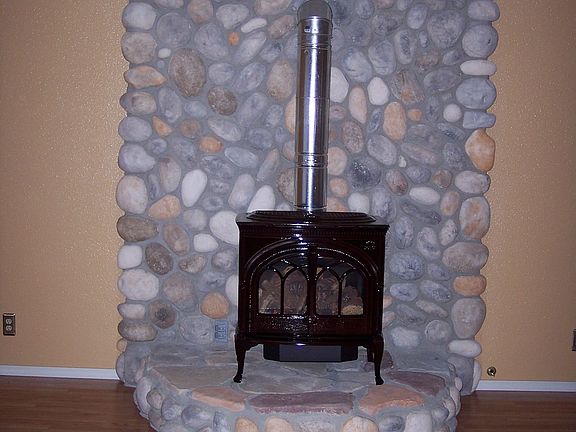 Jotul gas fireplace-river rock hearth