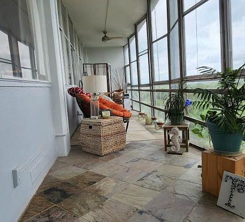 Glass porch over looking trees and West Paces Ferry Road
