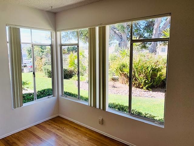 Large windows letting in the afternoon light. Landscape is professionally managed!