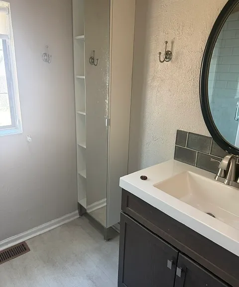Main floor Bath, includes shower sink and storage