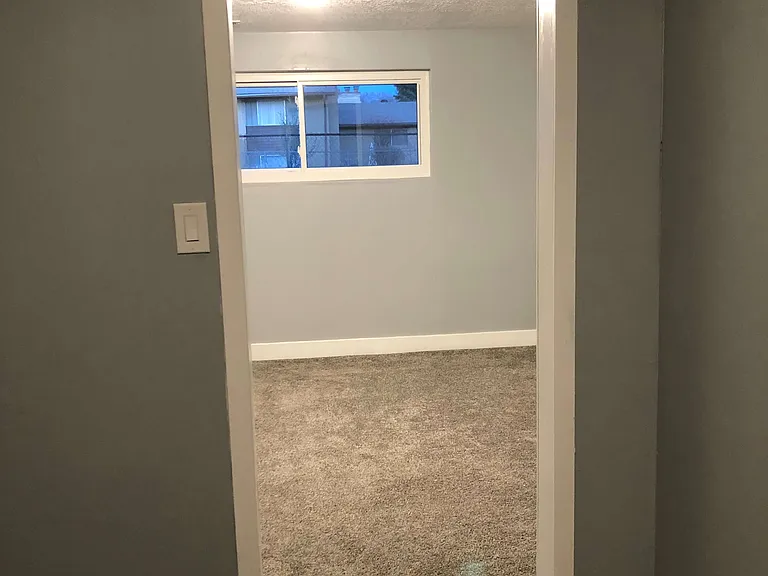 From kitchen looking into bedroom