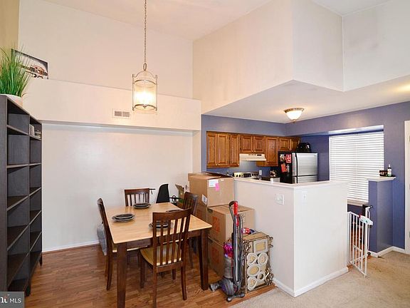 Spacious dining rm w/ laminate faux wood flooring!