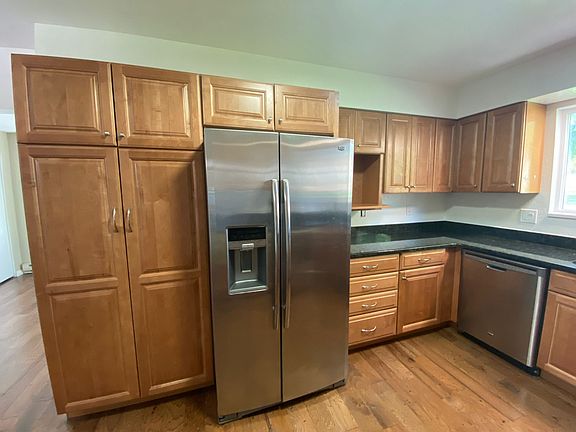 Dishwasher, large fridge, and pantry.