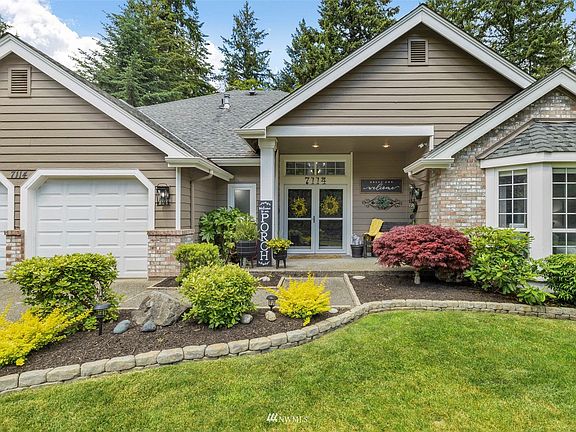 Private lot with 3 car garage wired for generator.