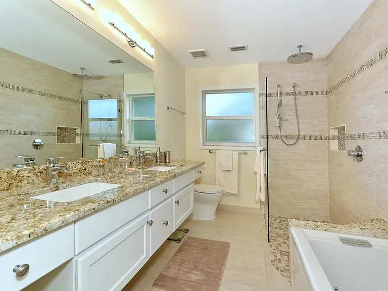 2nd bath with rainshower, double vanities, jetted tub