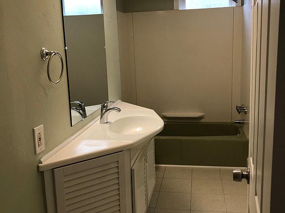 Upstairs main full bathroom; half bath in basement