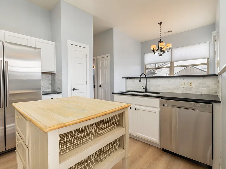 Samsung appliances, new granite countertops, ample pantry space