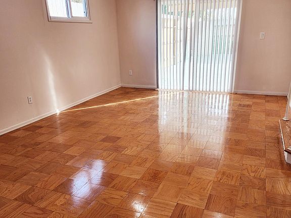 Living Room with resurfaced wood flooring.
