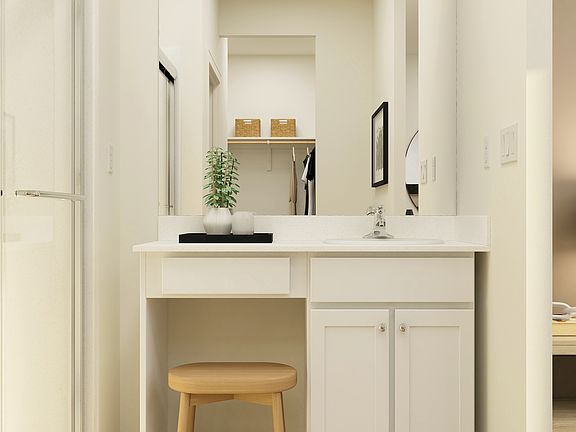 Inside the en-suite master bathroom, you ll find a step in shower and a large vanity!