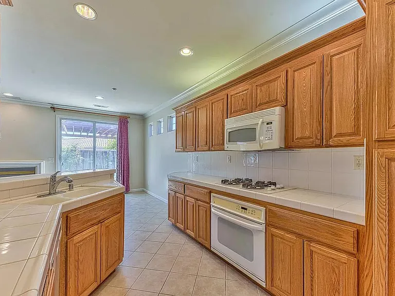 (Kitchen cabinets have been repainted and appliances have been updated since this photo)