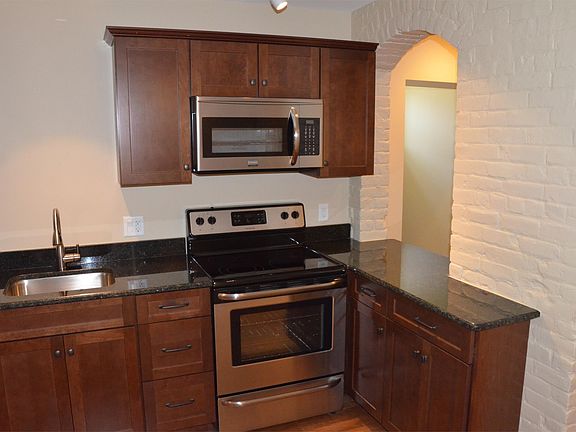 51 Allen #102 Kitchen with arch to living room