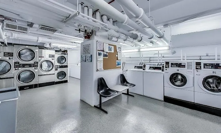 Shared laundry facility. Hi-efficiency washers and dryers.