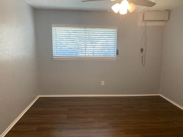 Bedroom has hardwood floors as well