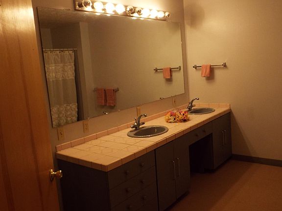 Master bathroom, double sink, ceramic tile counter, make-up