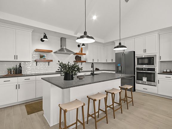 Kitchen with pendant lights floating shelves