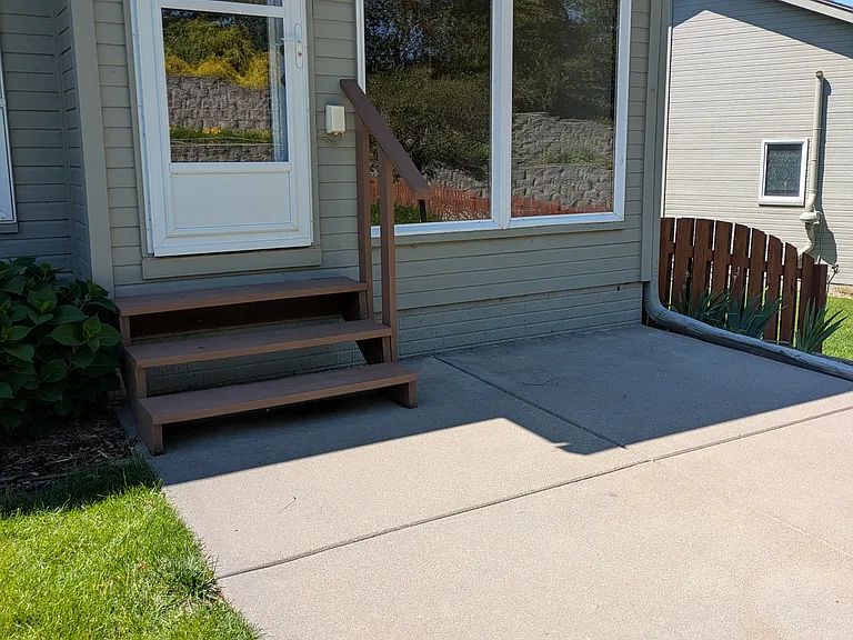 The patio is off the dining area, faces west,and offers beautiful sunsets and a quiet retreat.