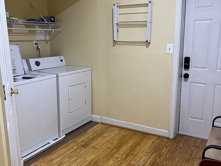 Back mudroom area with utilities and half bath