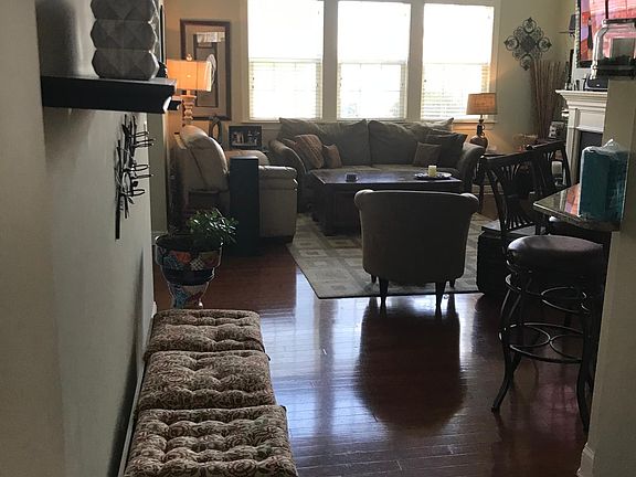 Open floor plan vaulted family room with natural gas fireplace