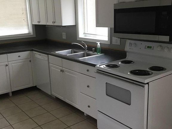 Kitchen - same space as previous photo, but with repainted cabinets
