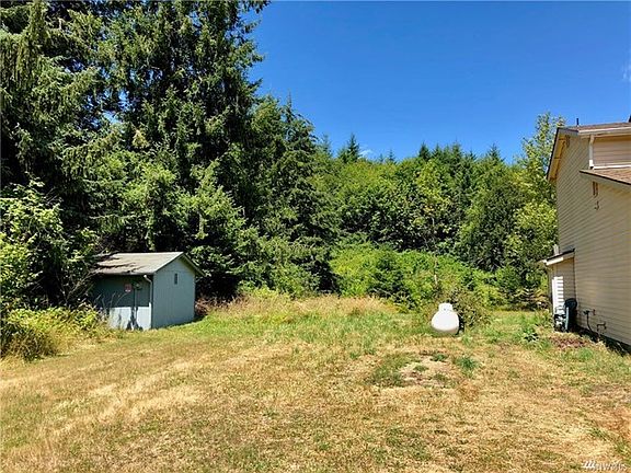 Left side of home with Community Water building easement.