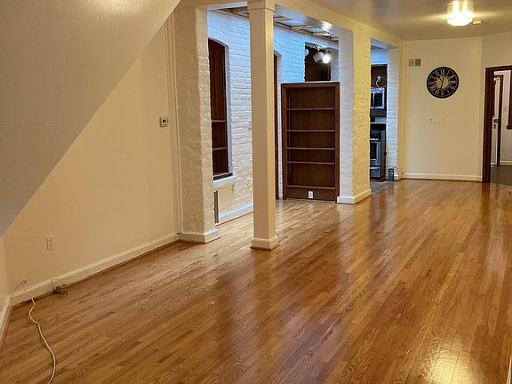 Living/dining area with skylight unfurnished