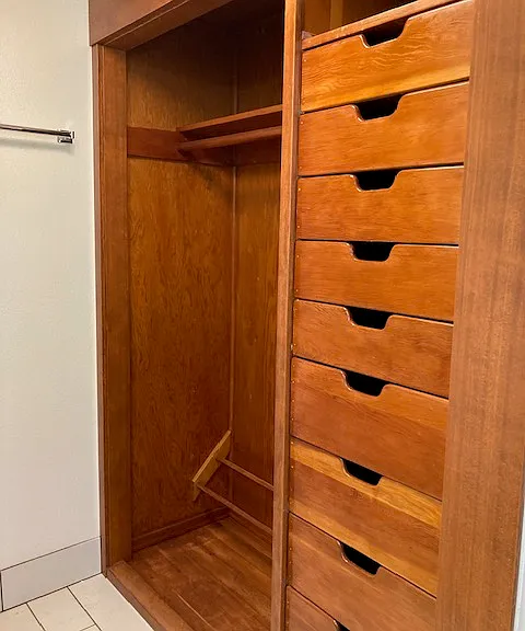 Built in closet in a secondary bedroom.