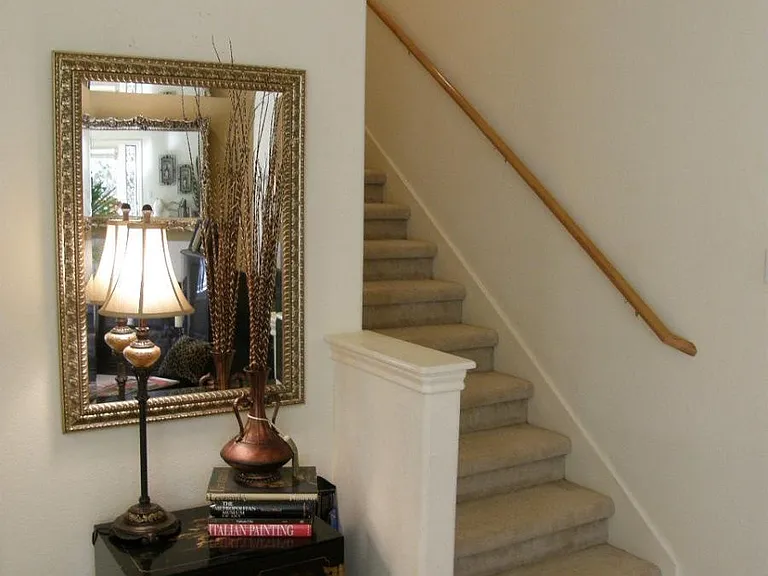 wall sconces lead up stairwell