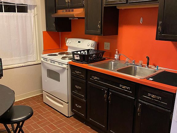 kitchen . electric range, garbage disposal .
