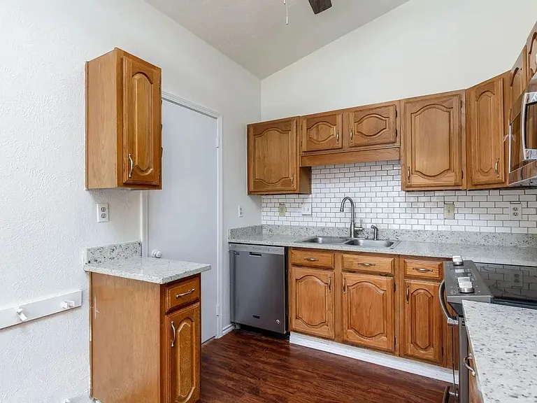 View of kitchen showing door to utility room.