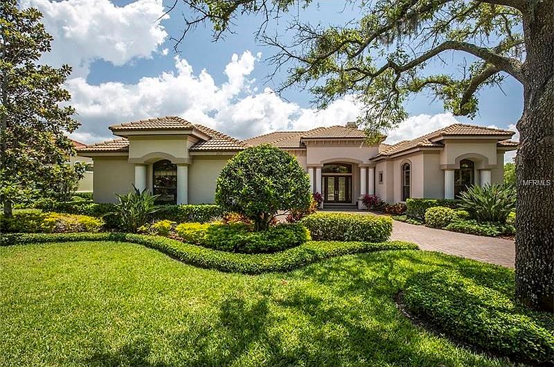 Lush landscaping accentuates the architectural beauty of this home with side entry 3 car garage. Loc