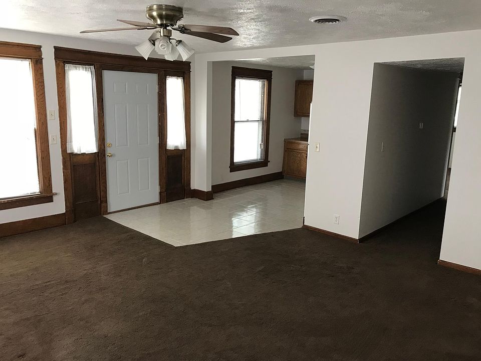 Living room looking towards kitchen and hallway to beds/bath