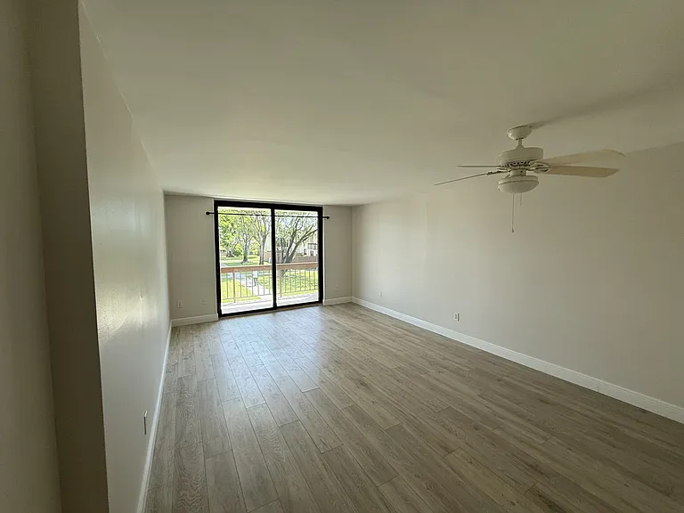 Living room, fan over new wood floor