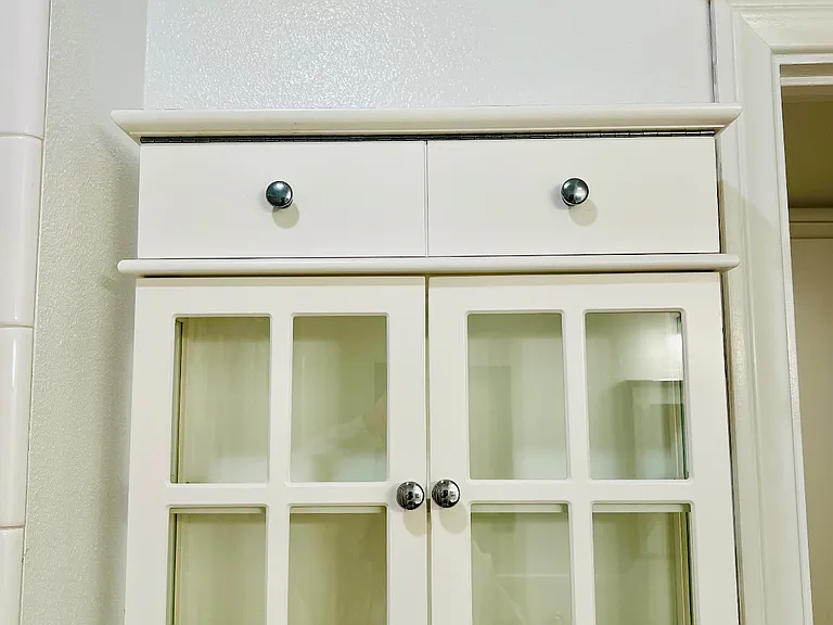 Storage cabinet in the guest bathroom