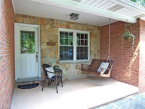 Quaint covered front porch - enjoying your morning coffee or tea!