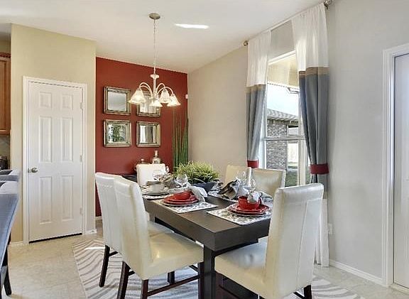 Photo of Model Home with Same Floor Plan, Not of Actual Home Listed