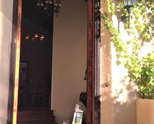 Open front door to formal entry