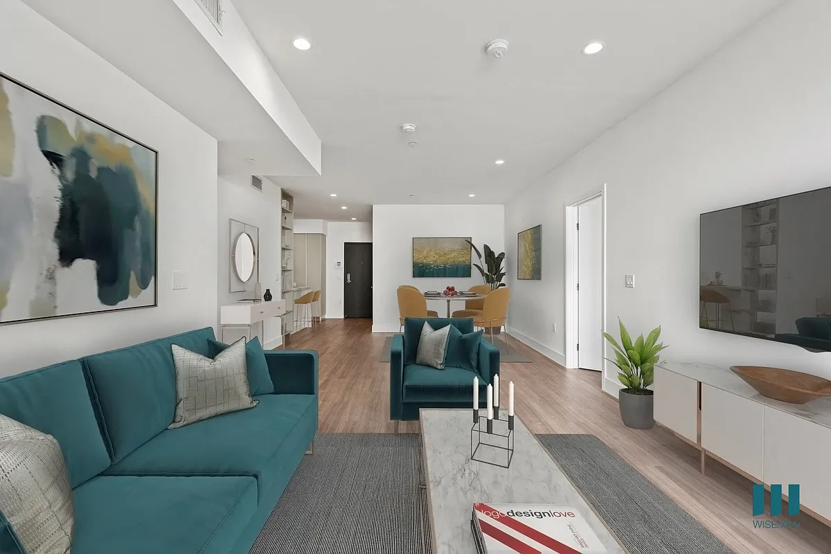Open-Concept Kitchen, Dining, and Living Room Space - Armacost Bella by Wiseman