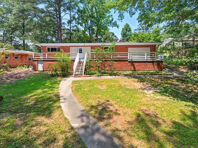 Spacious backyard & elevated patio perfect for family fun and outdoor gatherings!