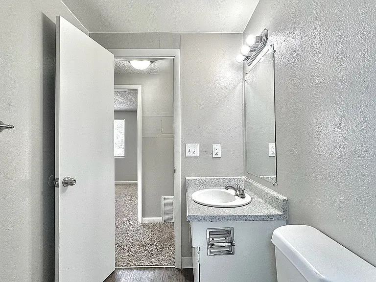 A clean, well-appointed bathroom with modern finishes and thoughtful details for everyday convenience.