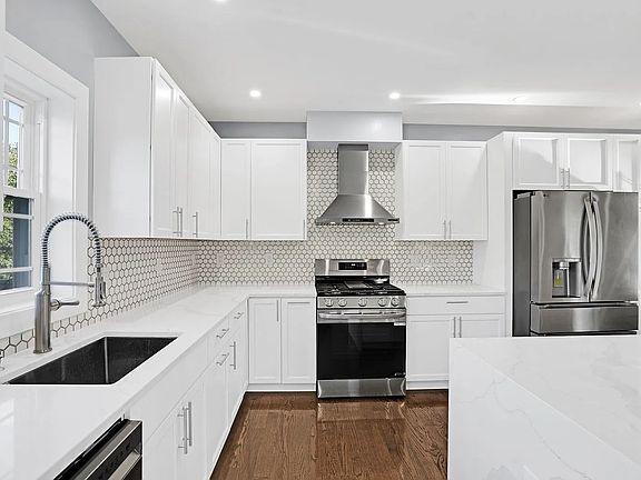 Kitchen with window for sunlight, high end appliances and great cabinetry.