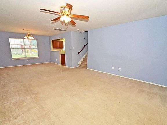 OPEN DEN WITH PLENTY OF LIGHT FROM BEAUTIFUL WINDOWS