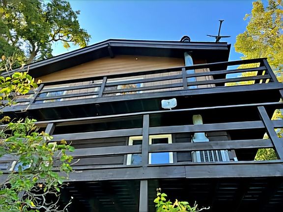Wrap around decks of the backyard and VIEW of the LAKE.