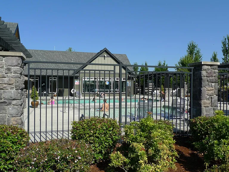 Club house of the townhouse community with inground heated pools and a small gym