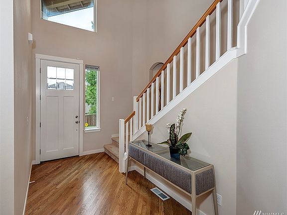 High-ceiling entrance with big windows bring in a lot of bright light.