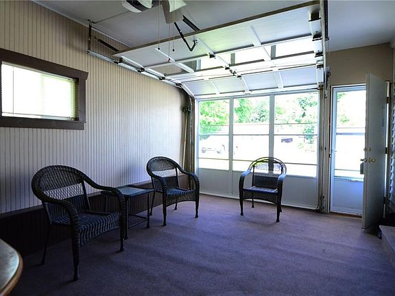 The outdoor/indoor carpet was cut to fit and is removed in winter so garage can be used for car in our Syracuse winters!