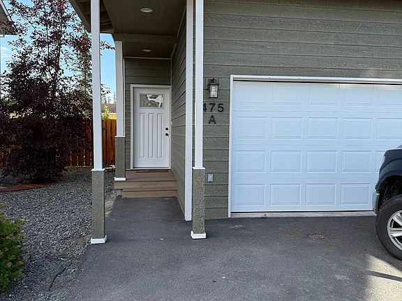 Covered Walkway, 2 Car Garage, 3 Bedrooms upstairs. Fenced backyard.