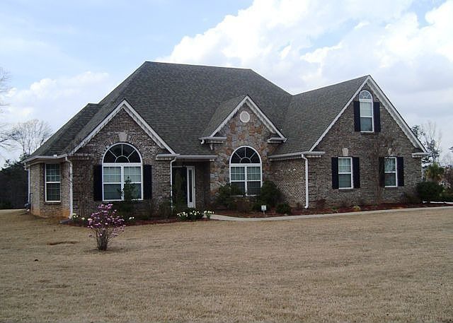 All brick ranch with bonus room.