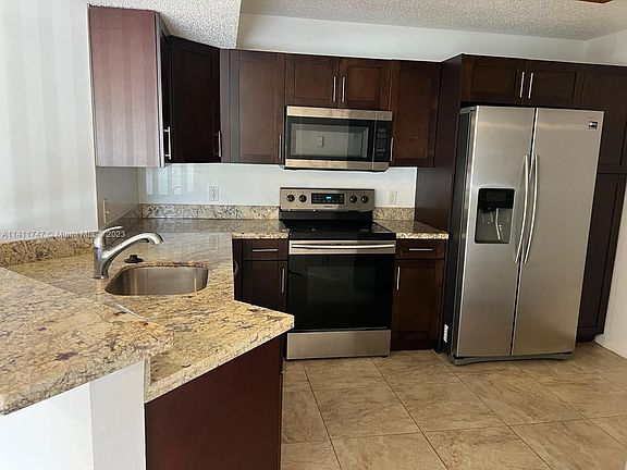 2nd image of 8741 Wiles Rd APT 103